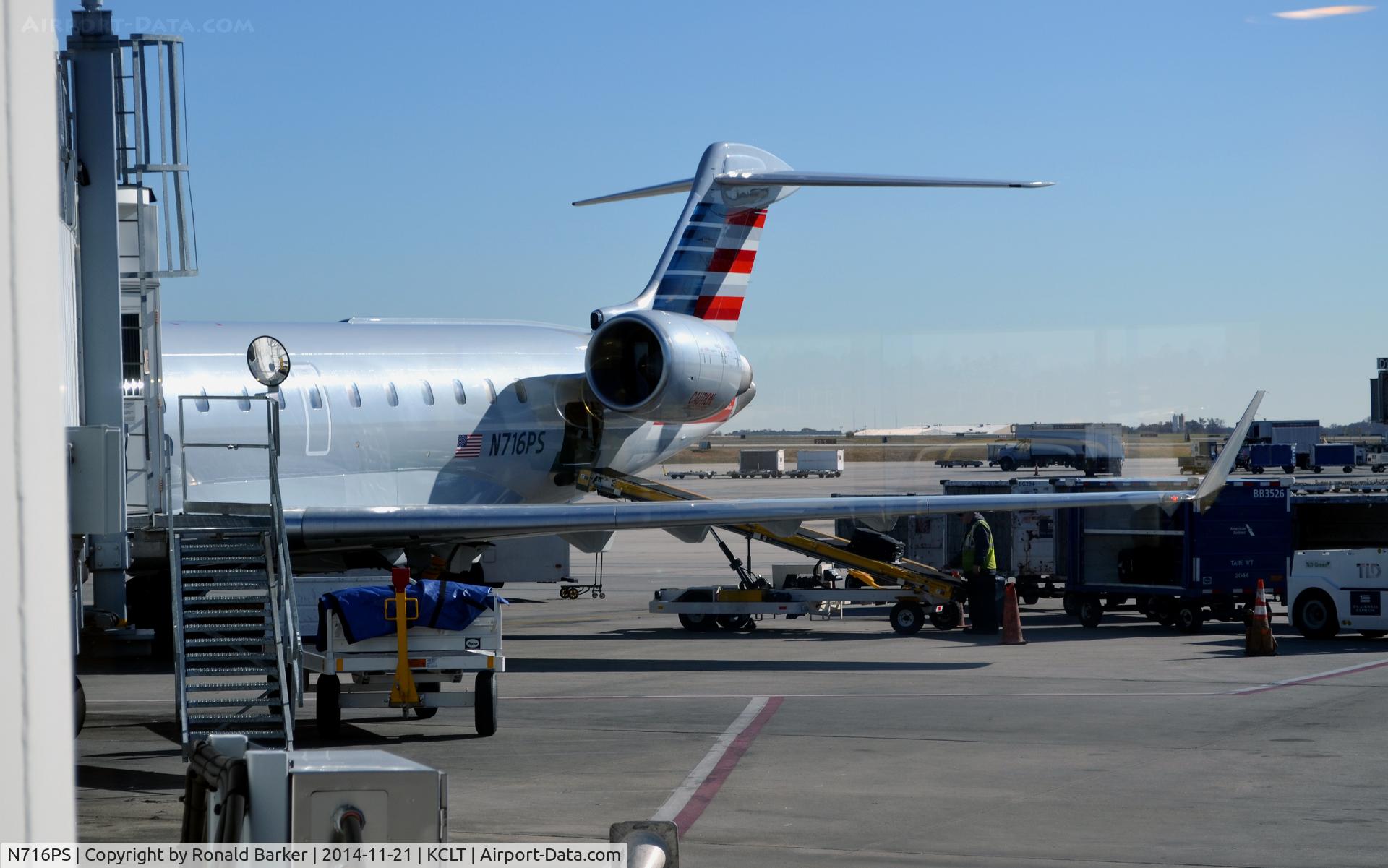 N716PS, 2004 Bombardier CRJ-701 (CL-600-2C10) Regional Jet C/N 10171, At the gate CLT
