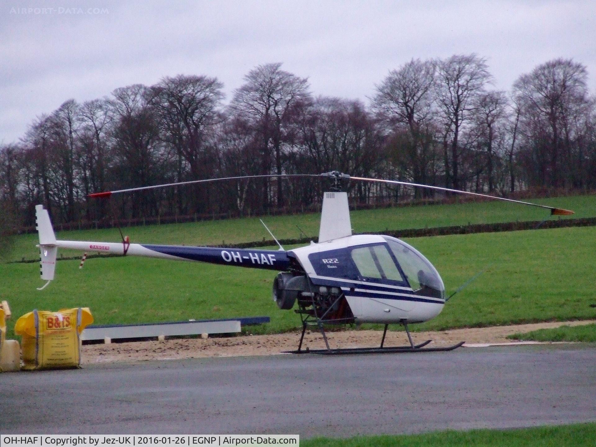OH-HAF, 1987 Robinson R22 Beta C/N 0655, parked outside maintainence hanger at Coneypark UK, operated by Eves-AIR Finland,
