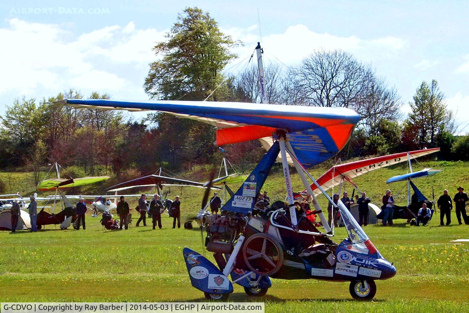 G-CDVO, 2005 P&M Aviation Pegasus Quik C/N 8147, P & M Aviation Quik [8147] Popham~G 03/05/2014. Note all the stickers as well as the wheel  possibly used by a wheelchair bound person from the detail in the photo.