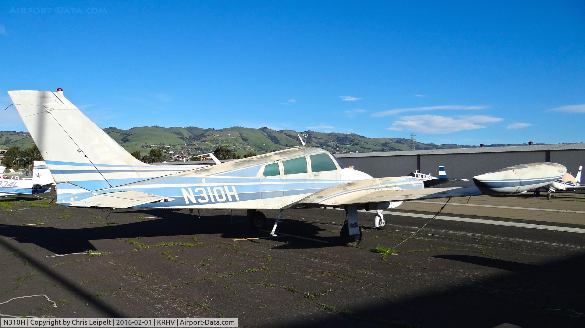 N310H, 1964 Cessna 310I C/N 310I0159, Locally-based 1964 Cessna 310I looking better than ever (no more flat tires!!) parked at a temporary tie down to make room for all the transient Super Bowl 50 aircraft coming to Reid Hillview Airport, San Jose, CA.