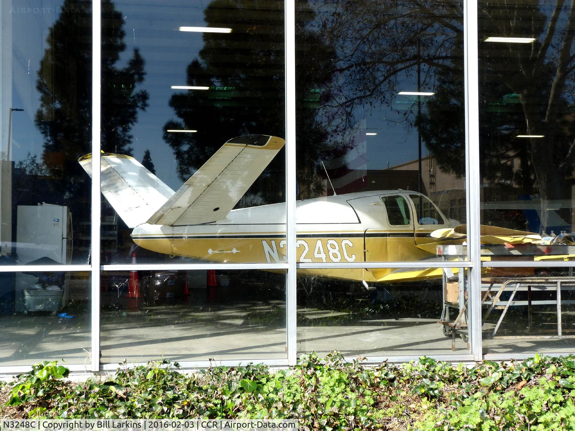 N3248C, 1954 Beech E35 C/N D-3913, Resting in Pacific States display window.