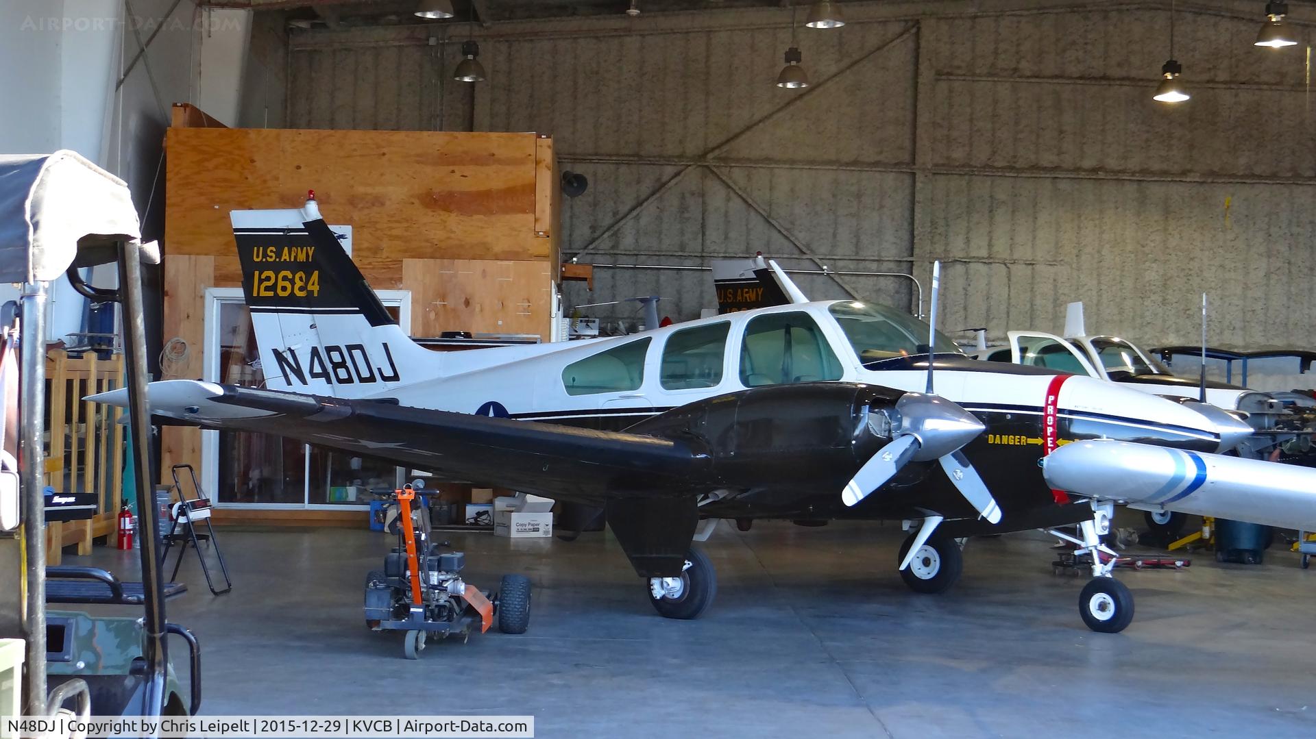 N48DJ, 1965 Beech T-42A Cochise C/N TF-6, Oregon-based 1965 Beechcraft T-42A Cochise parked inside the maintenance hangar at Nut Tree Airport, Vacaville, CA.