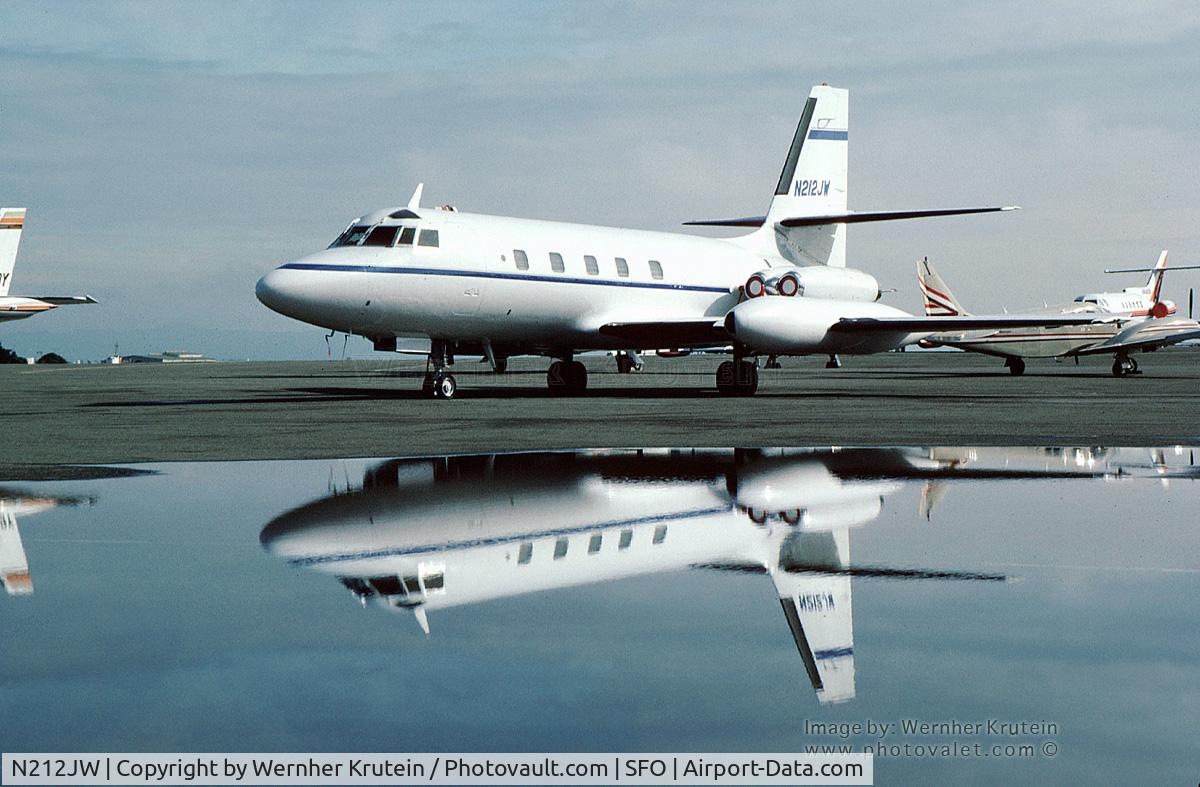 N212JW, 1969 Lockheed L-1329-23E JetStar C/N 5131, N212JW resting on a rainy tarmac