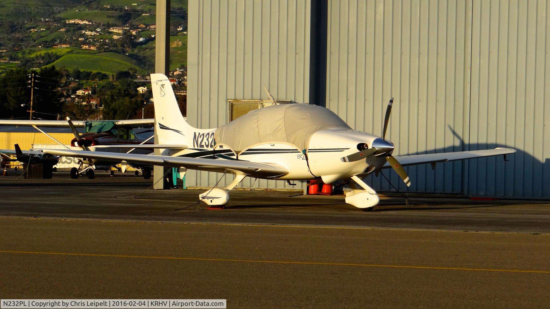 N232PL, 2001 Cirrus SR20 C/N 1159, South County-based 2001 Cirrus SR20 parked in front of the Trade Winds hangar, possibly for maintenance at Reid Hillview Airport, San Jose, CA.