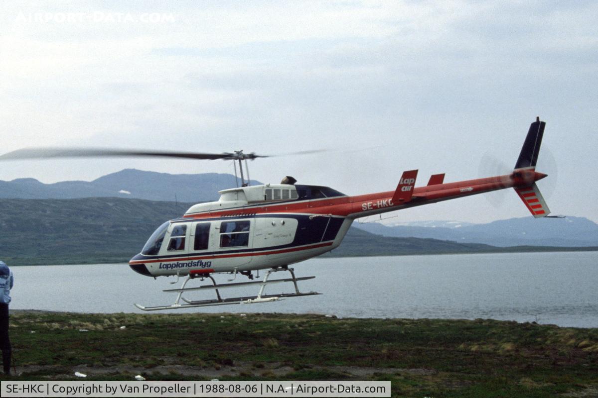 SE-HKC, 1979 Bell 206L-1 LongRanger II C/N 45321, Bell 206L-1 LongRanger II of Laplandsflyg (Lap-Air) taking off in Staloluokta, Lapland, northern Sweden. Lake Virihaure in the background.