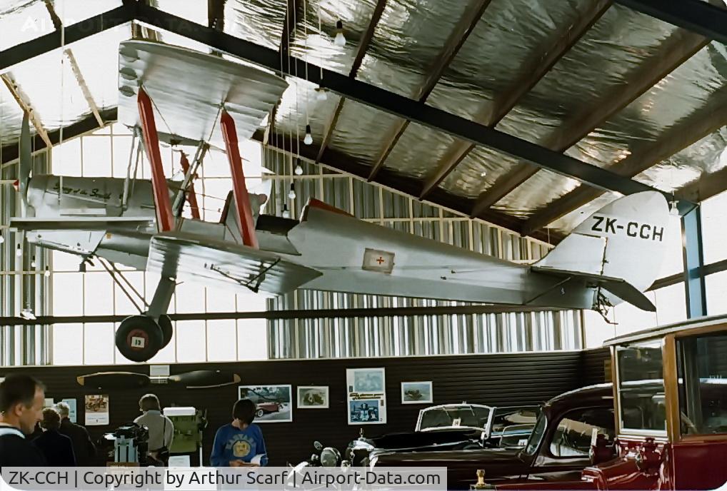 ZK-CCH, De Havilland New Zealand DH-82A Tiger Moth C/N DHNZ110, ZK-CCH hanging in the Queenstown Motor Museum NZ c.1978