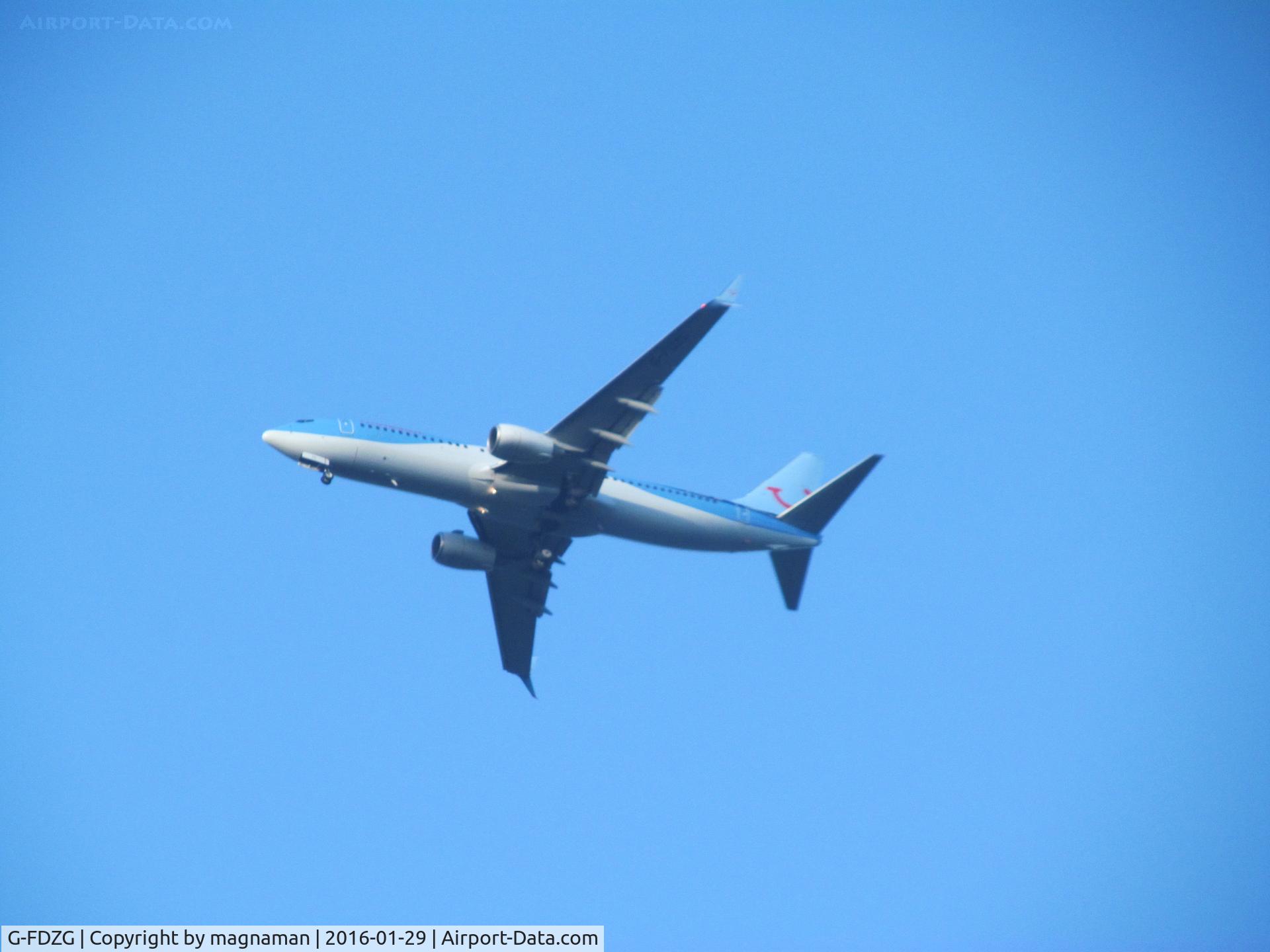 G-FDZG, 2008 Boeing 737-8K5 C/N 35139, flying past office window into exter