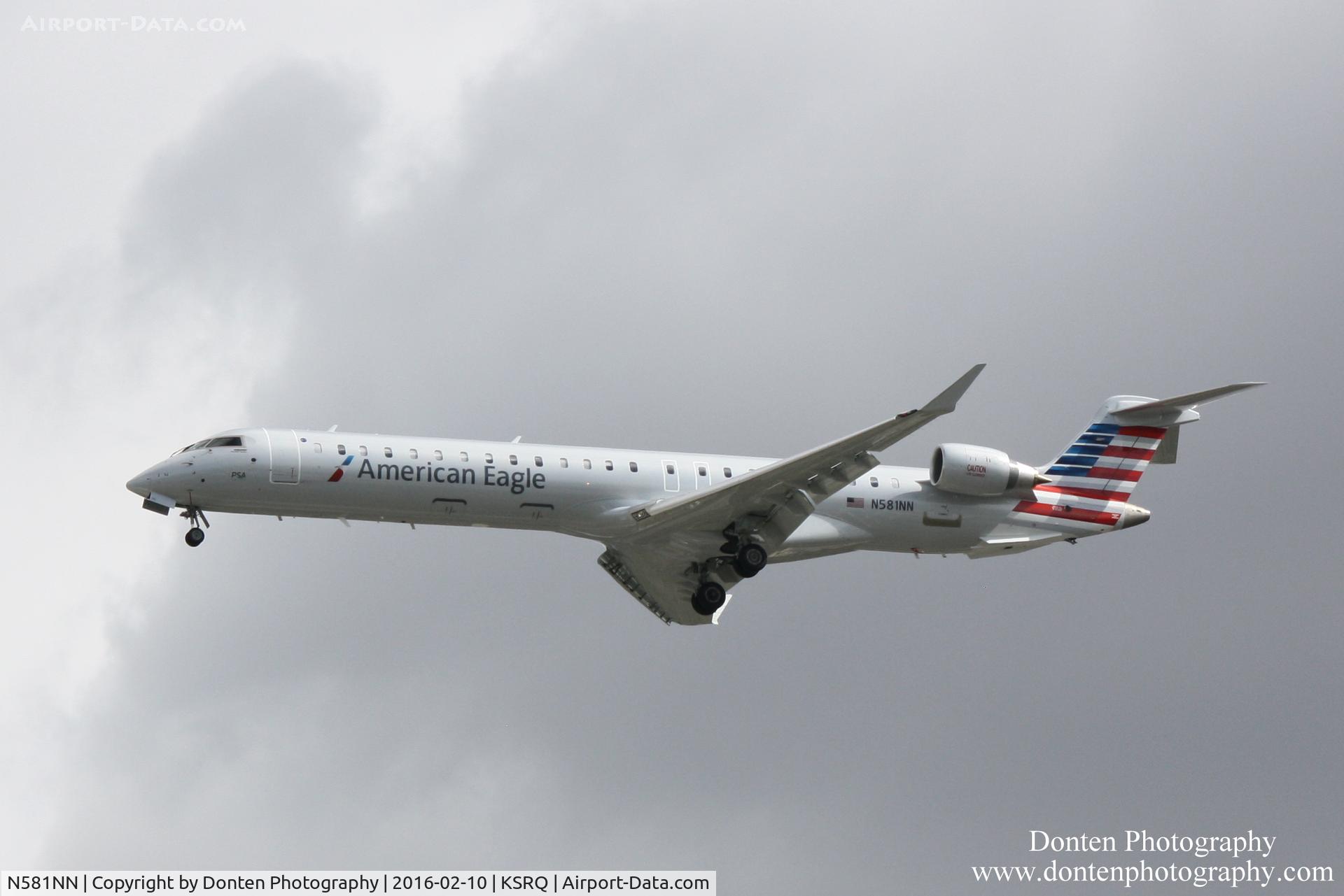 N581NN, 2015 Bombardier CRJ-900 (CL-600-2D24) C/N 15384, American Flight 5139 operated by PSA (N581NN) arrives at Sarasota-Bradenton International Airport following flight from Charlotte-Douglas International Airport