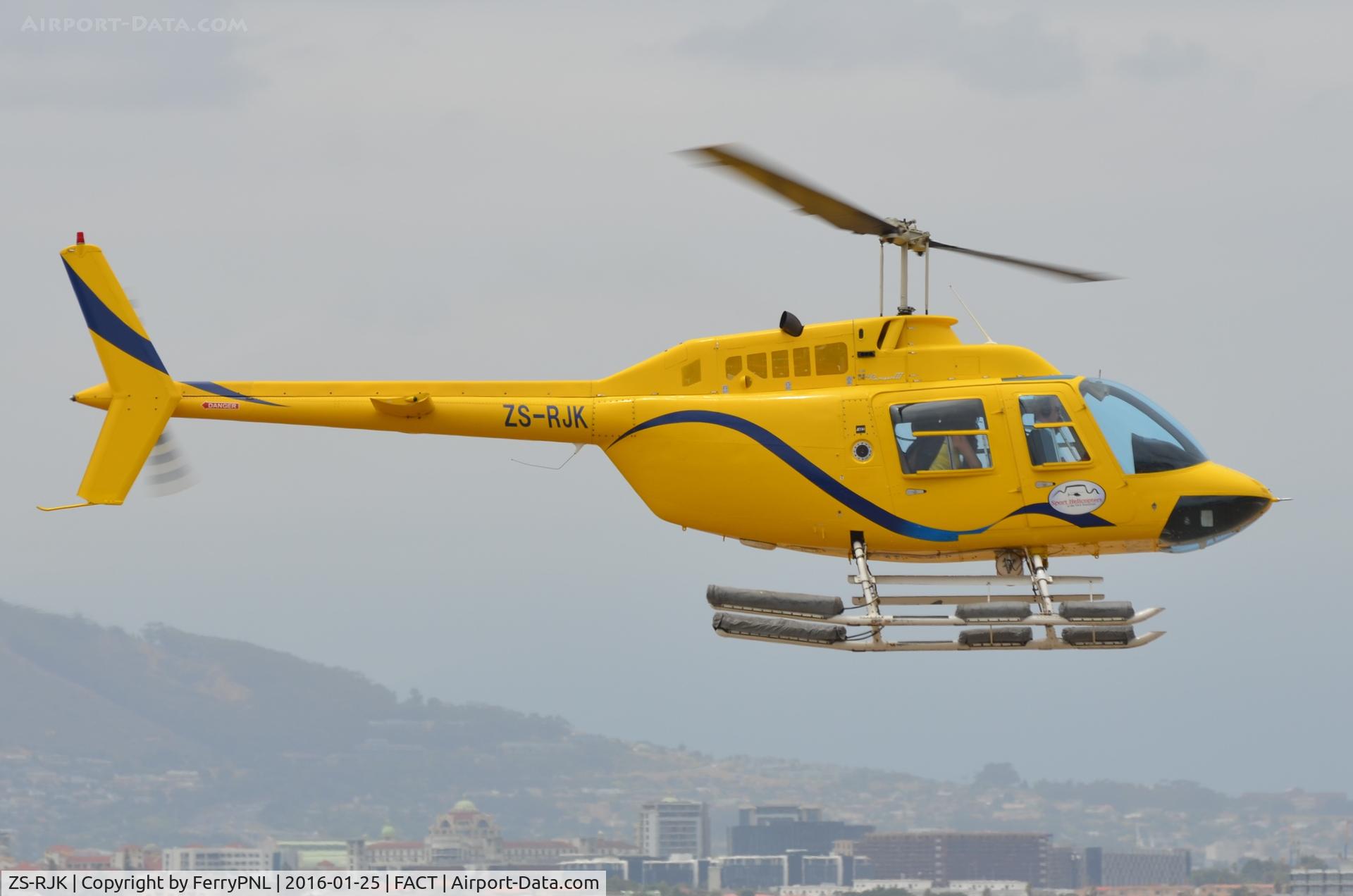 ZS-RJK, 1986 Bell 206B C/N 3811, Sport Helicopters B206 arrives from a sight seeing flight.