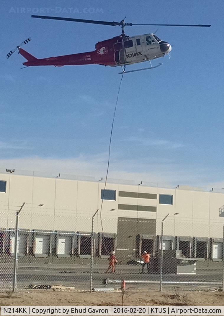 N214KK, 1964 Bell UH-1H Iroquois C/N 4267 (64-13560), N214KK long-line lifting HVAC units atop new distribution center in Tucson AZ.  One mile NE of KTUS.