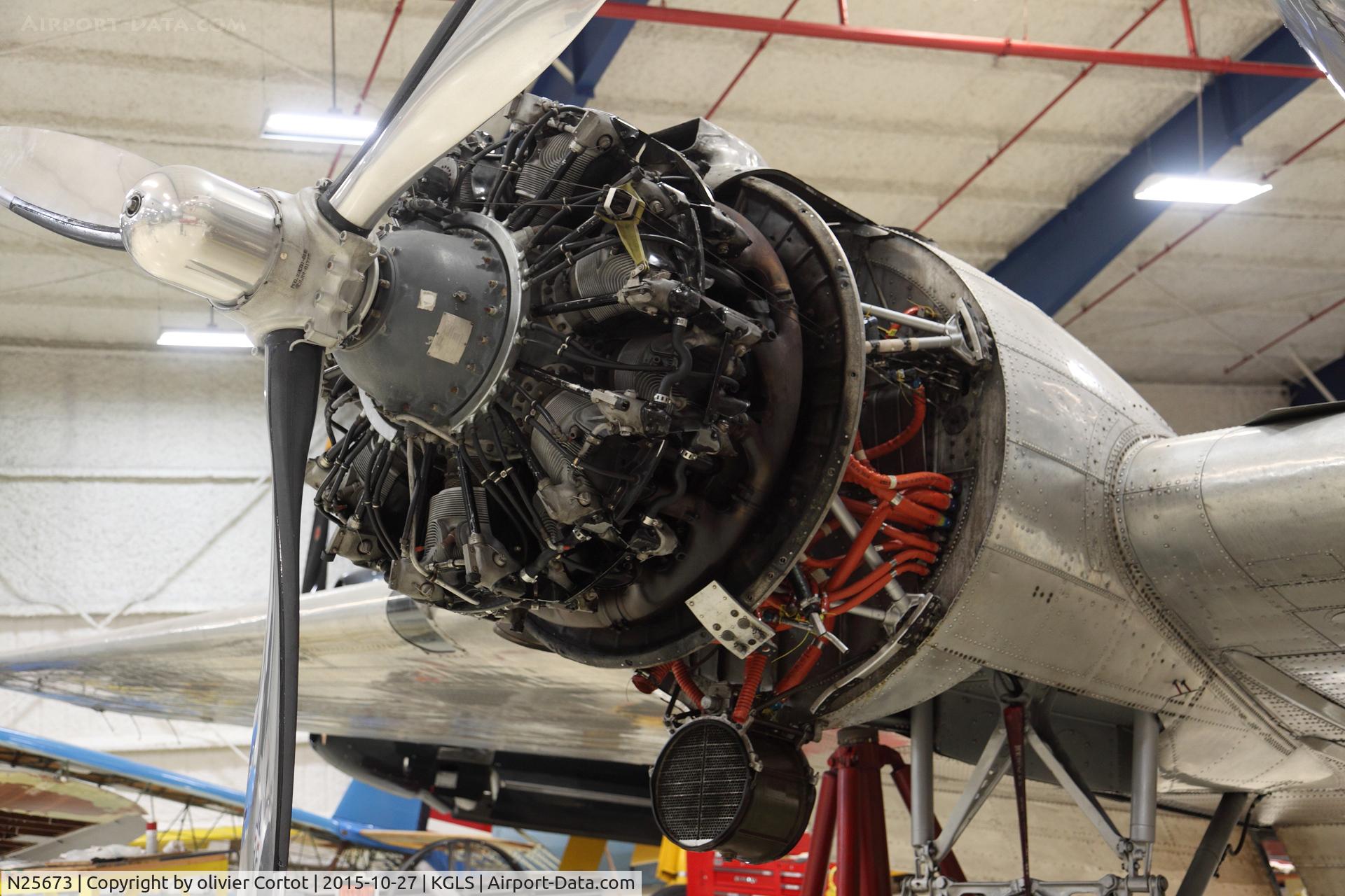 N25673, 1940 Douglas DC-3A C/N 2213, working on the engines, lone star museum