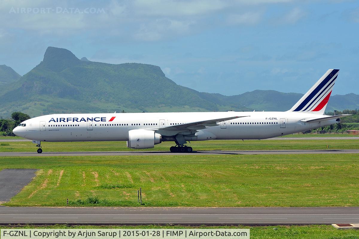 F-GZNL, 2012 Boeing 777-328/ER C/N 40063, Taxiing past Lion Mountain in the background.