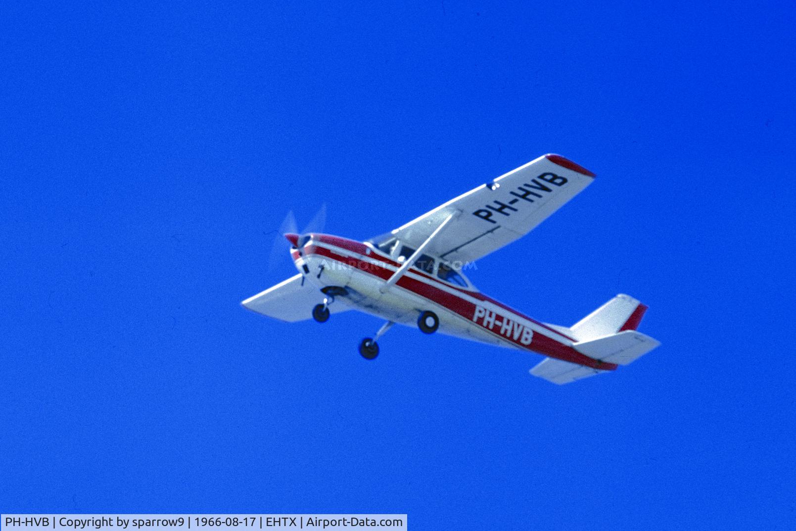 PH-HVB, 1965 Reims F172F Skyhawk C/N 0160, On anice blue day overhead Texel A/D. Scanned from a slide.