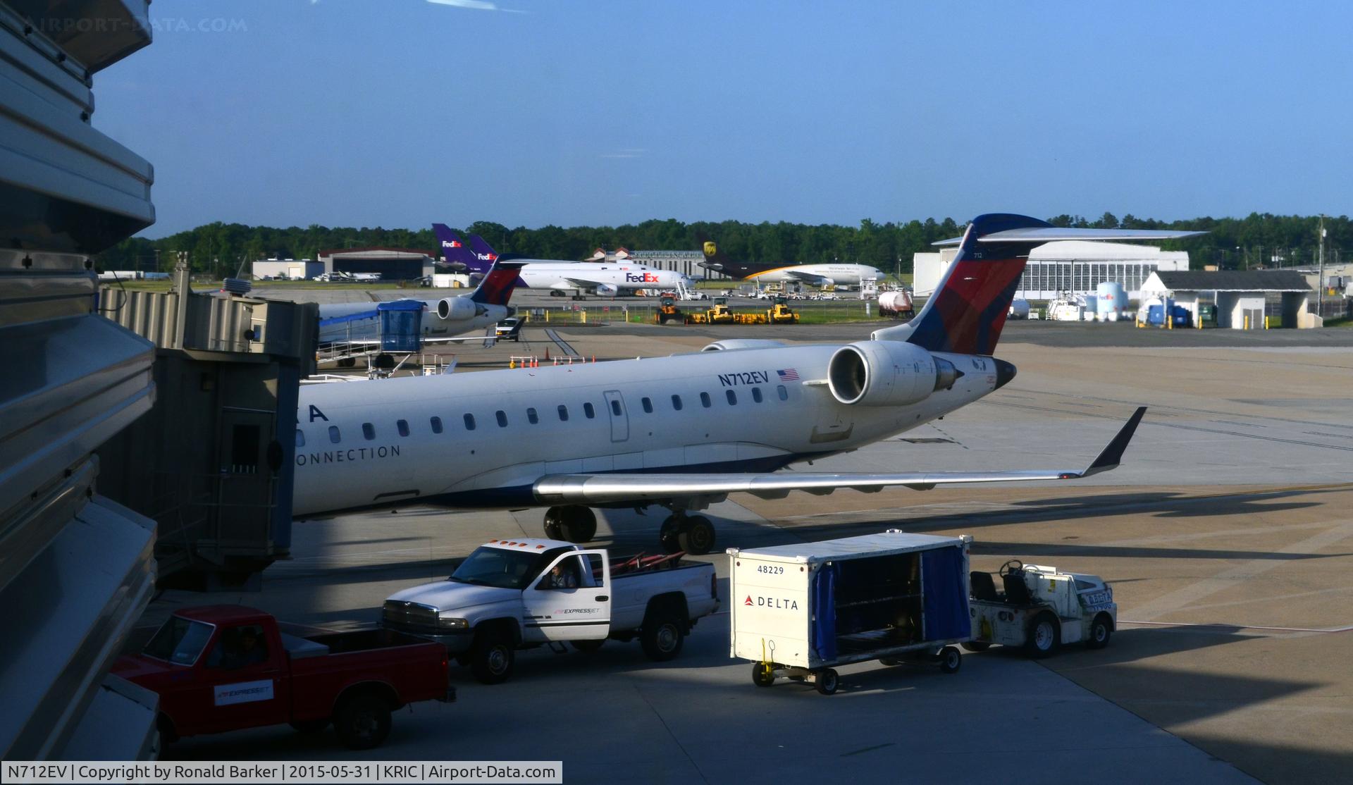 N712EV, 2002 Bombardier CRJ-701ER (CL-600-2C10) Regional Jet C/N 10074, At the gate Richmond