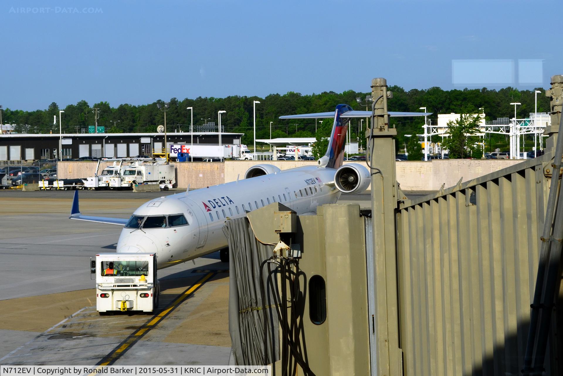N712EV, 2002 Bombardier CRJ-701ER (CL-600-2C10) Regional Jet C/N 10074, Pushback Richmond