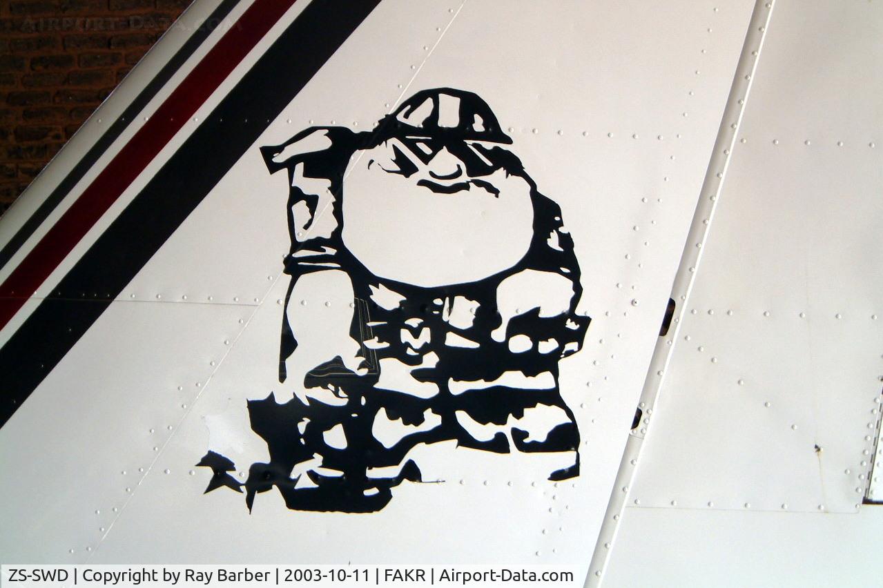 ZS-SWD, Piper PA-23-250 Aztec E C/N 274730, ZS-SWD   Piper PA-23-250 Aztec E [27-4730] Krugersdorp~ZS 11/10/2003. Showing tail artwork.