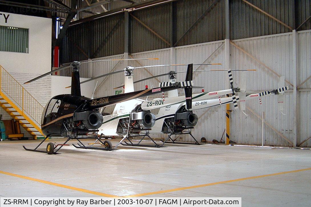 ZS-RRM, Robinson R22 Beta C/N 3481, Robinson R-22 Beta II [3481] Rand~ZS 07/10/2003. Seen here with ZS-ROH and ZS-ROV.