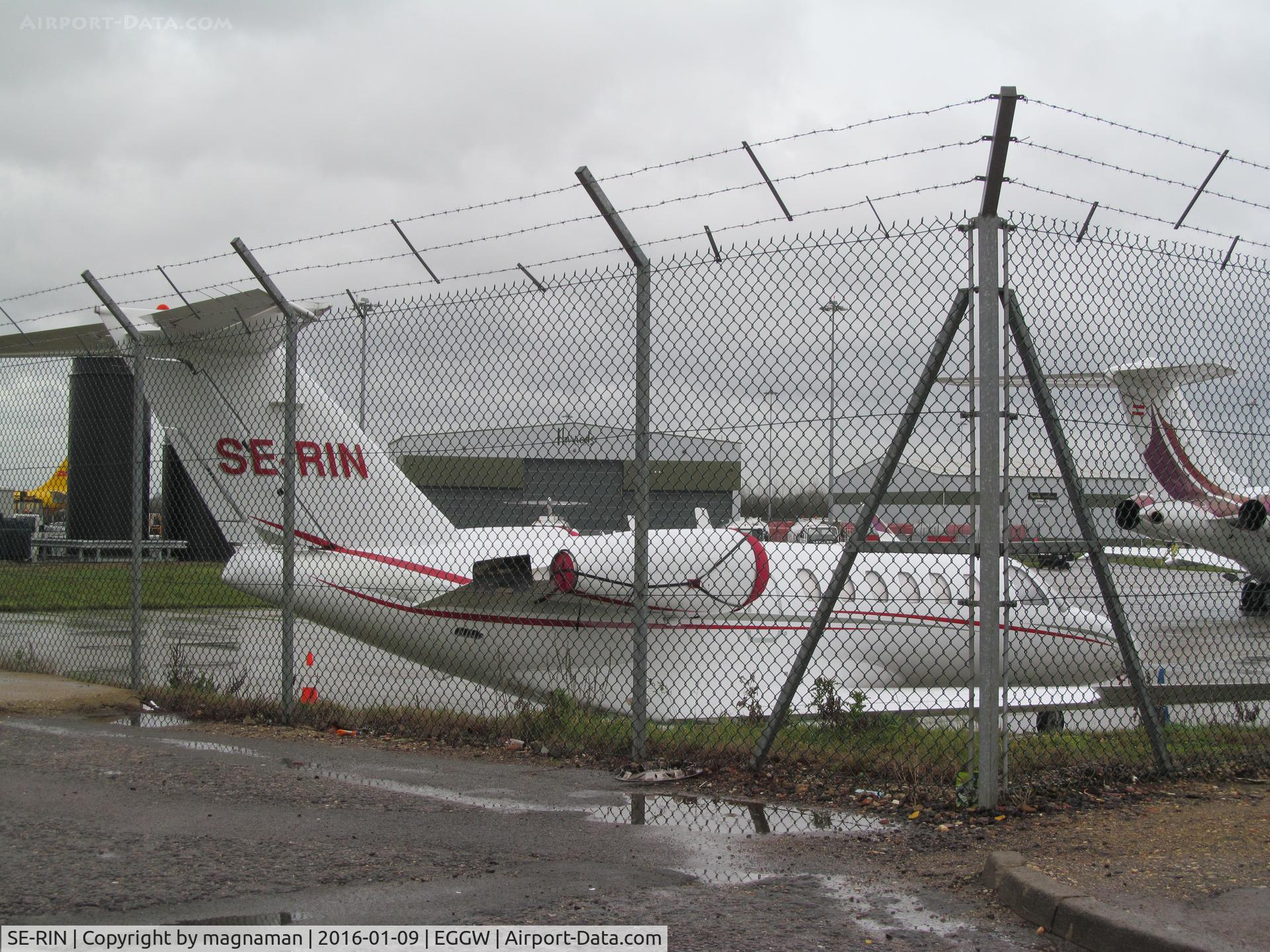 SE-RIN, 2003 Cessna 525A CitationJet CJ2 C/N 525A-0190, at luton - shame fence there