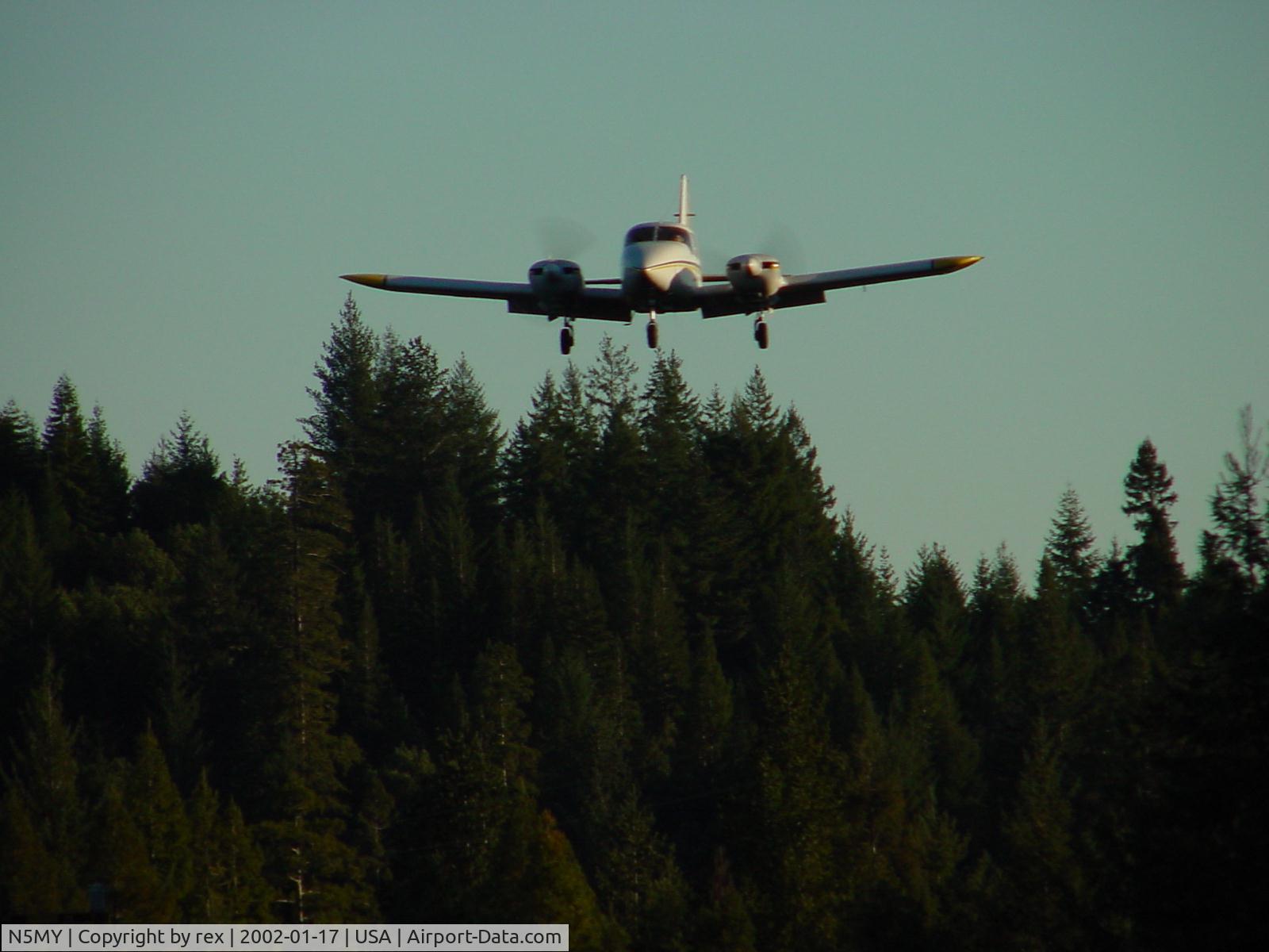 N5MY, 1973 Piper PA-23-250 C/N 27-7405258, N5MY on short approach from north end of private runway in Annapolis California Jan 17 2002. runway less than 1800 feet trees on both approaches.