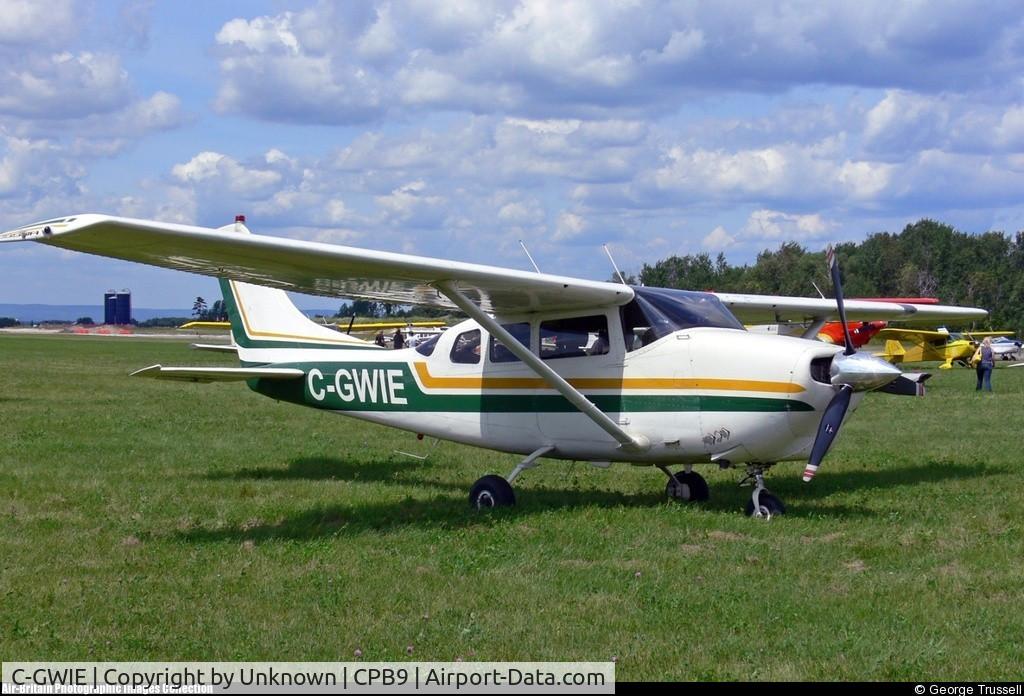 C-GWIE, 1963 Cessna 210-5A (205A) C/N 205-0498, Sitting in field at Baldwin, Ontario, were I purchased the aircraft and now it's home is Kincardine, Ontario CYKM.