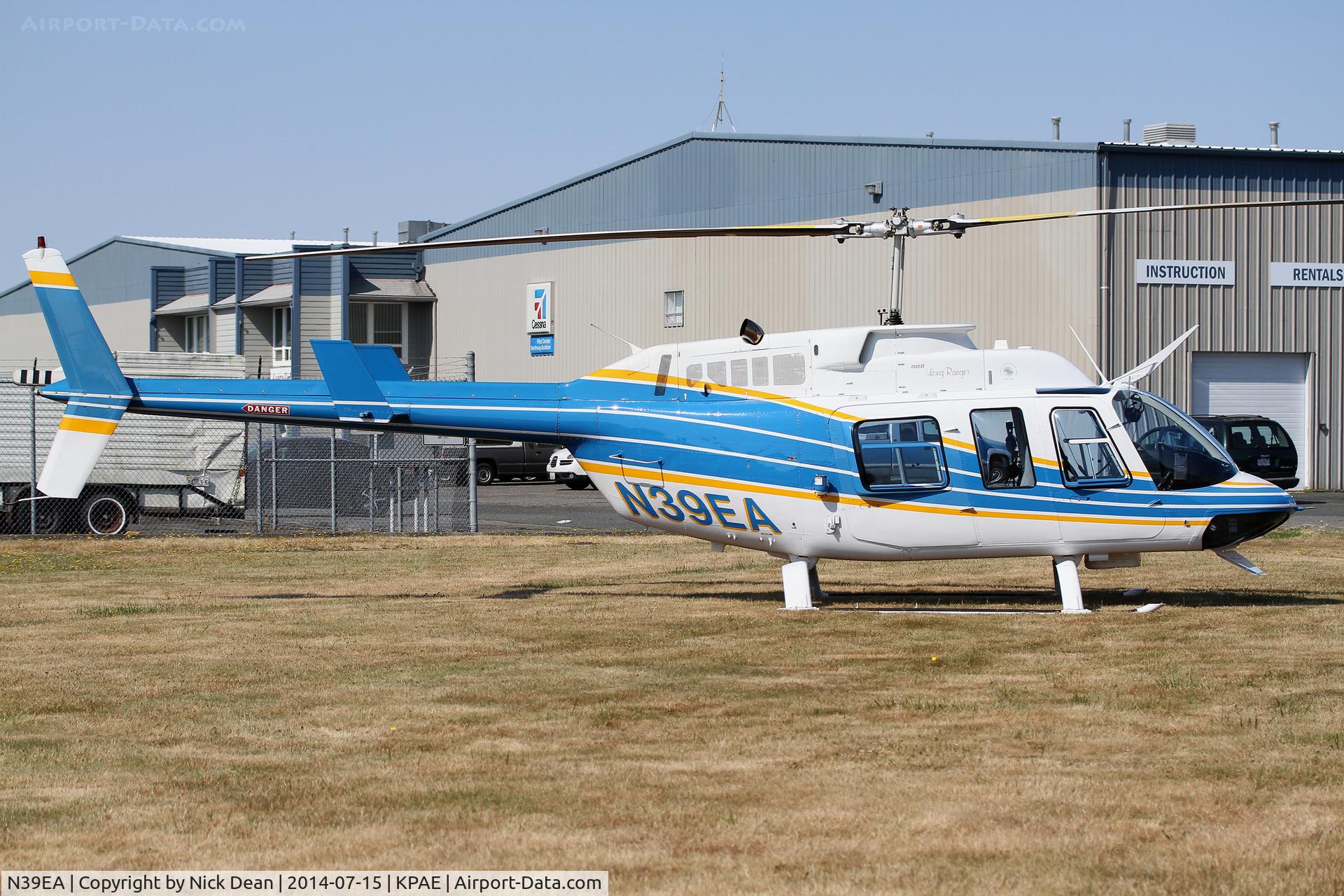 N39EA, 1975 Bell 206L LongRanger C/N 45007, Sitting on the grass behind our building.