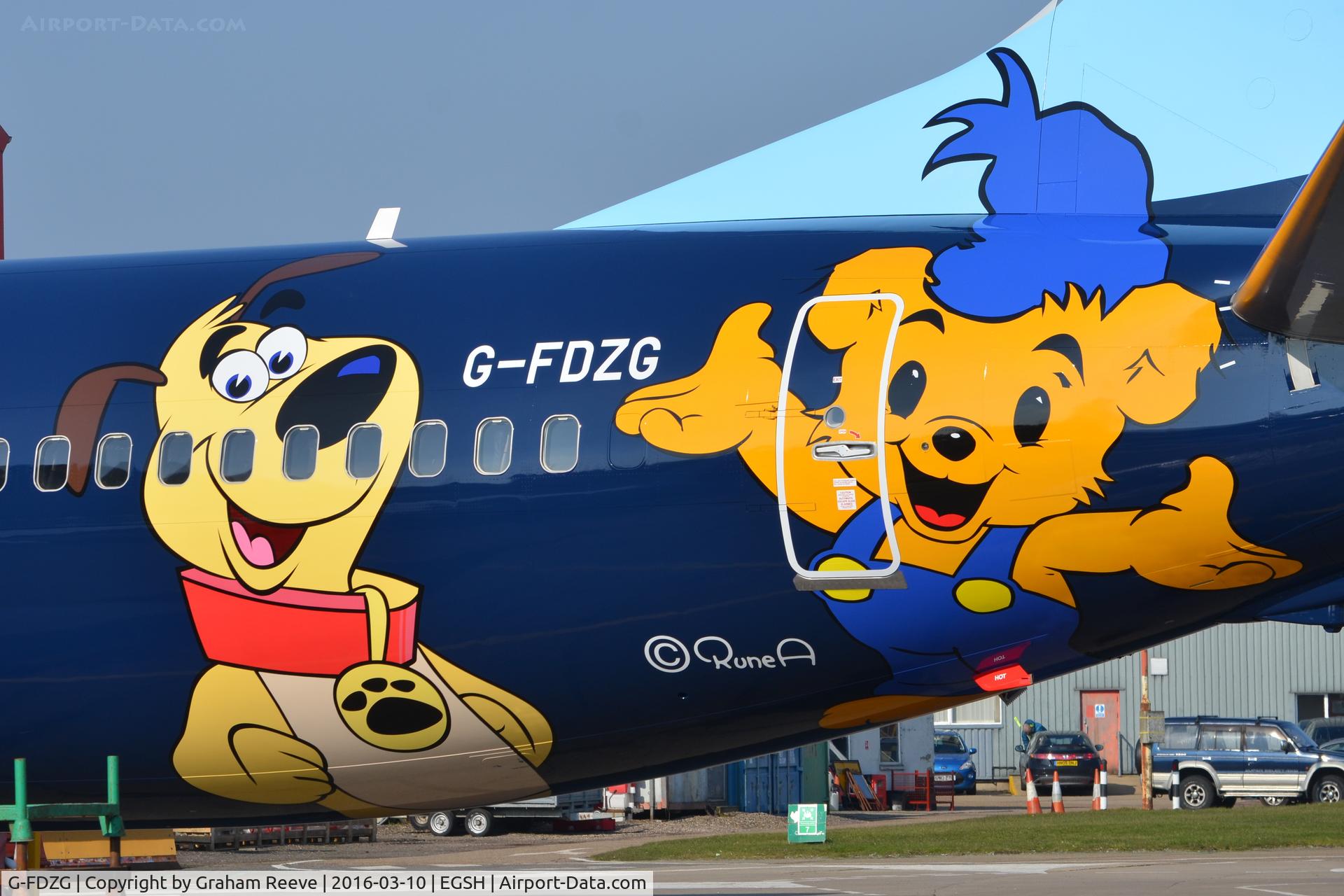 G-FDZG, 2008 Boeing 737-8K5 C/N 35139, Close up of new logo's on the aircraft.