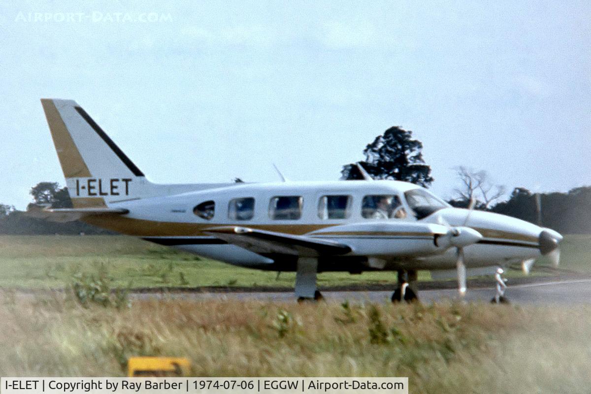 I-ELET, Piper PA-31-310 Turbo Navajo Navajo C/N 31-7400986, Piper PA-31-310 Turbo Navajo B [31-7400986] Luton~G 06/07/1974. From a slide. Taken through wire fence.