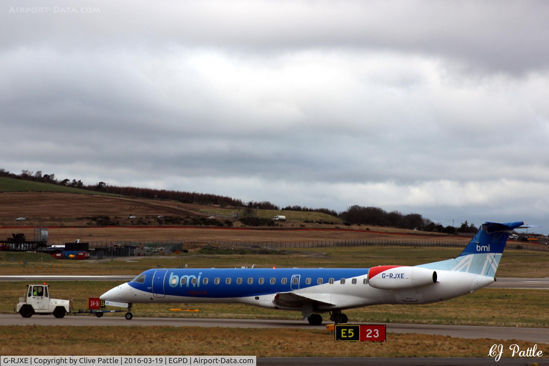 G-RJXE, 2000 Embraer EMB-145EP (ERJ-145EP) C/N 145245, Being towed from the BMI engineering hangar to the Terminal at Aberdeen EGPD