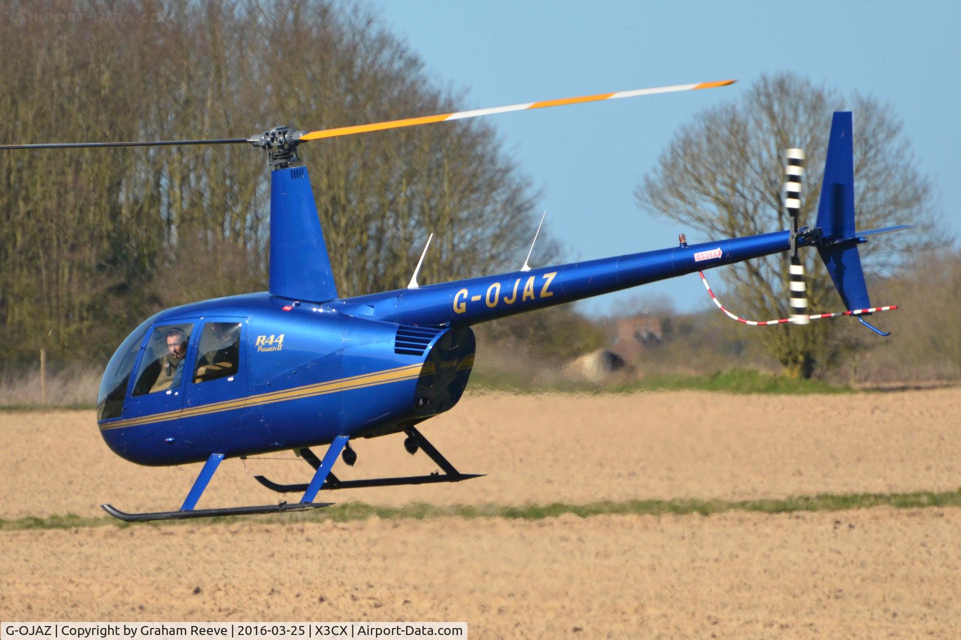 G-OJAZ, 2006 Robinson R44 Raven II C/N 11216, About to land at Northrepps.