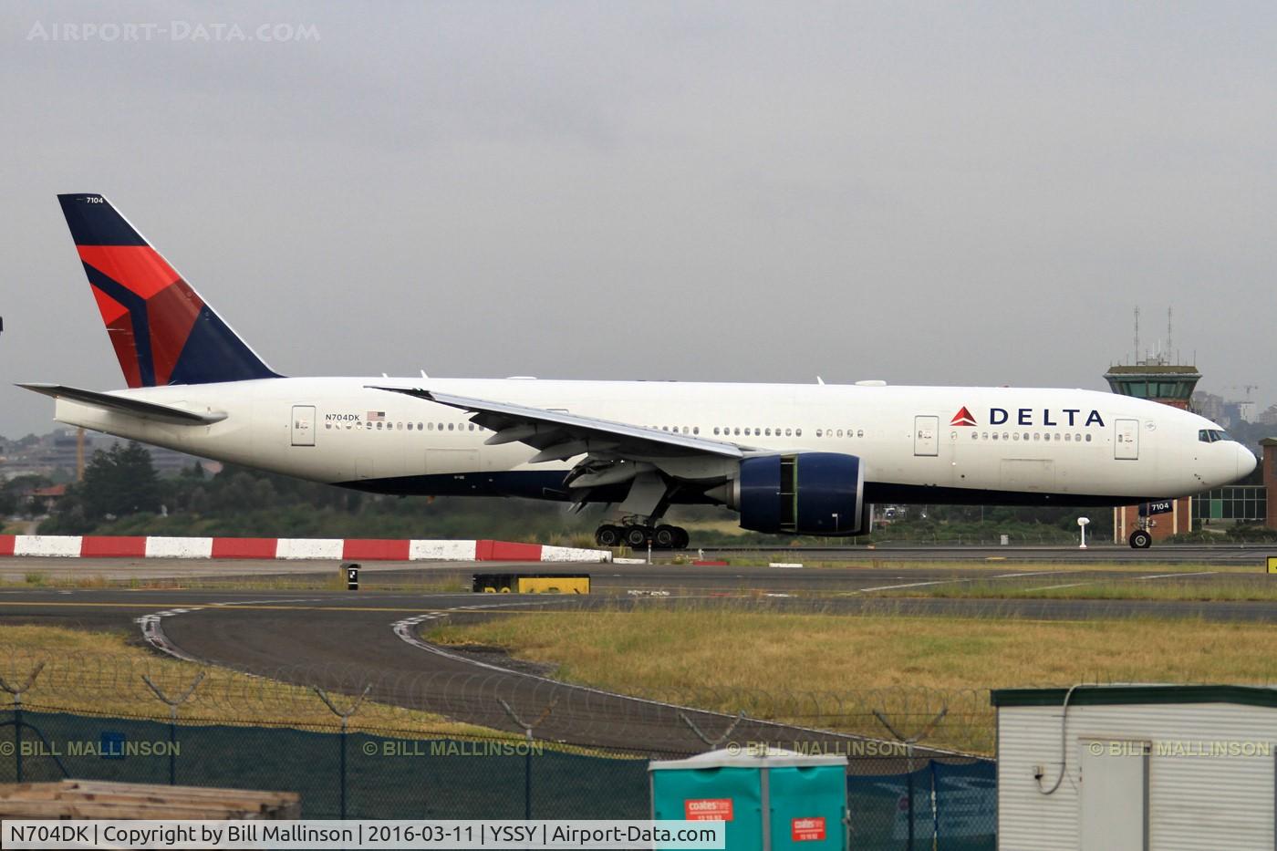 N704DK, 2009 Boeing 777-232/LR C/N 29739, taxiing from 34L