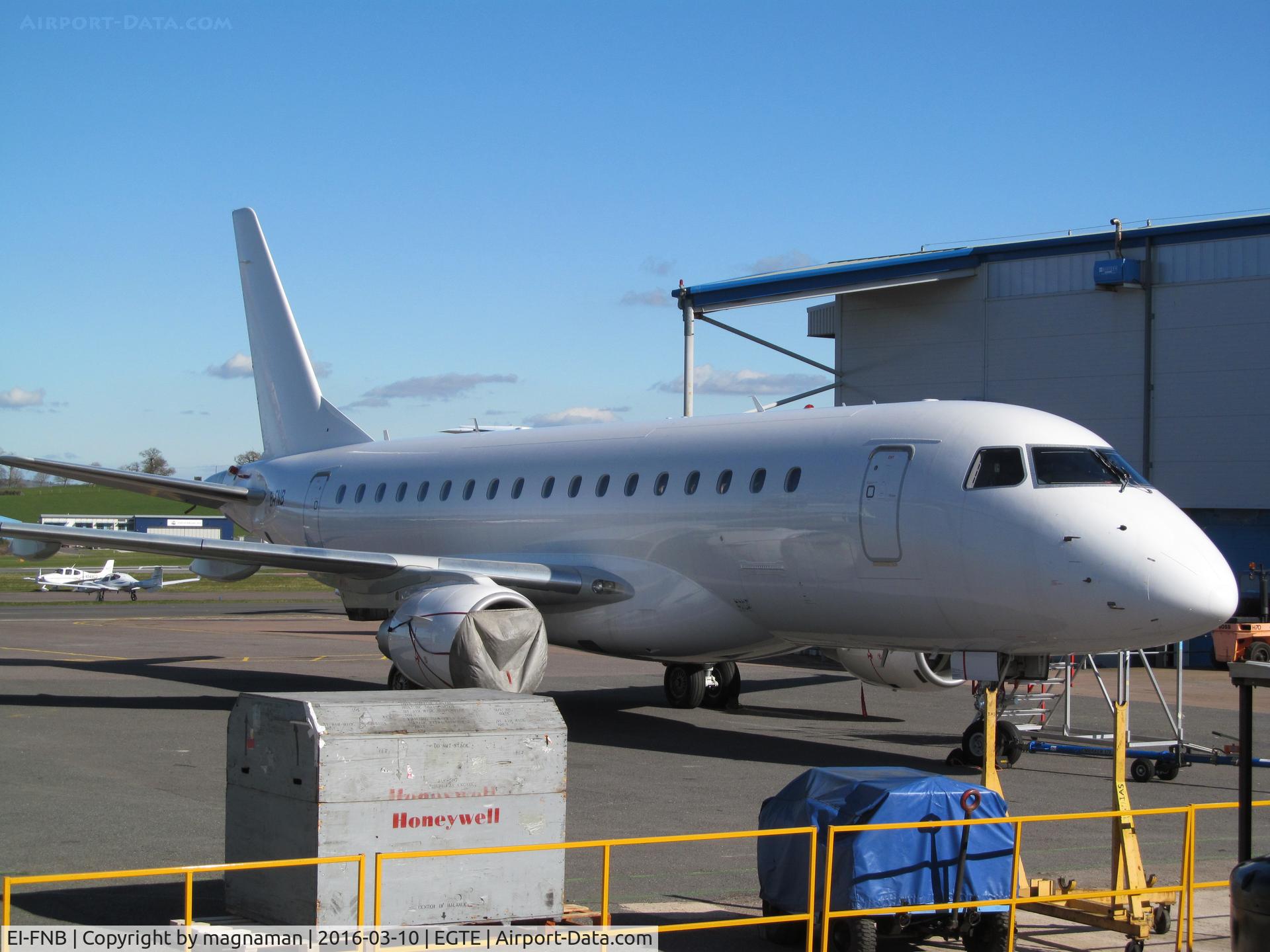 EI-FNB, 2005 Embraer 170LR (ERJ-170-100LR) C/N 17000093, at exeter in between hangars