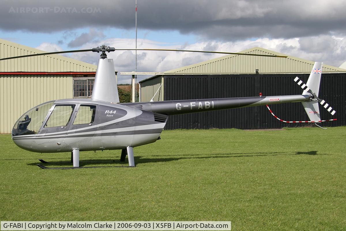 G-FABI, 1997 Robinson R44 Astro C/N 0325, Robinson R44 Astro at Fishburn Airfield, UK, September 2006.