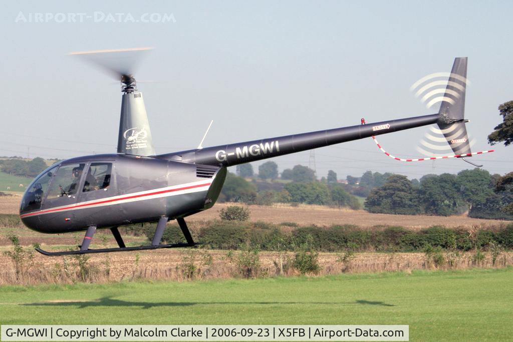 G-MGWI, 2000 Robinson R44 Astro C/N 0663, Robinson R44 Astro, Fishburn Airfield, September 2006.
