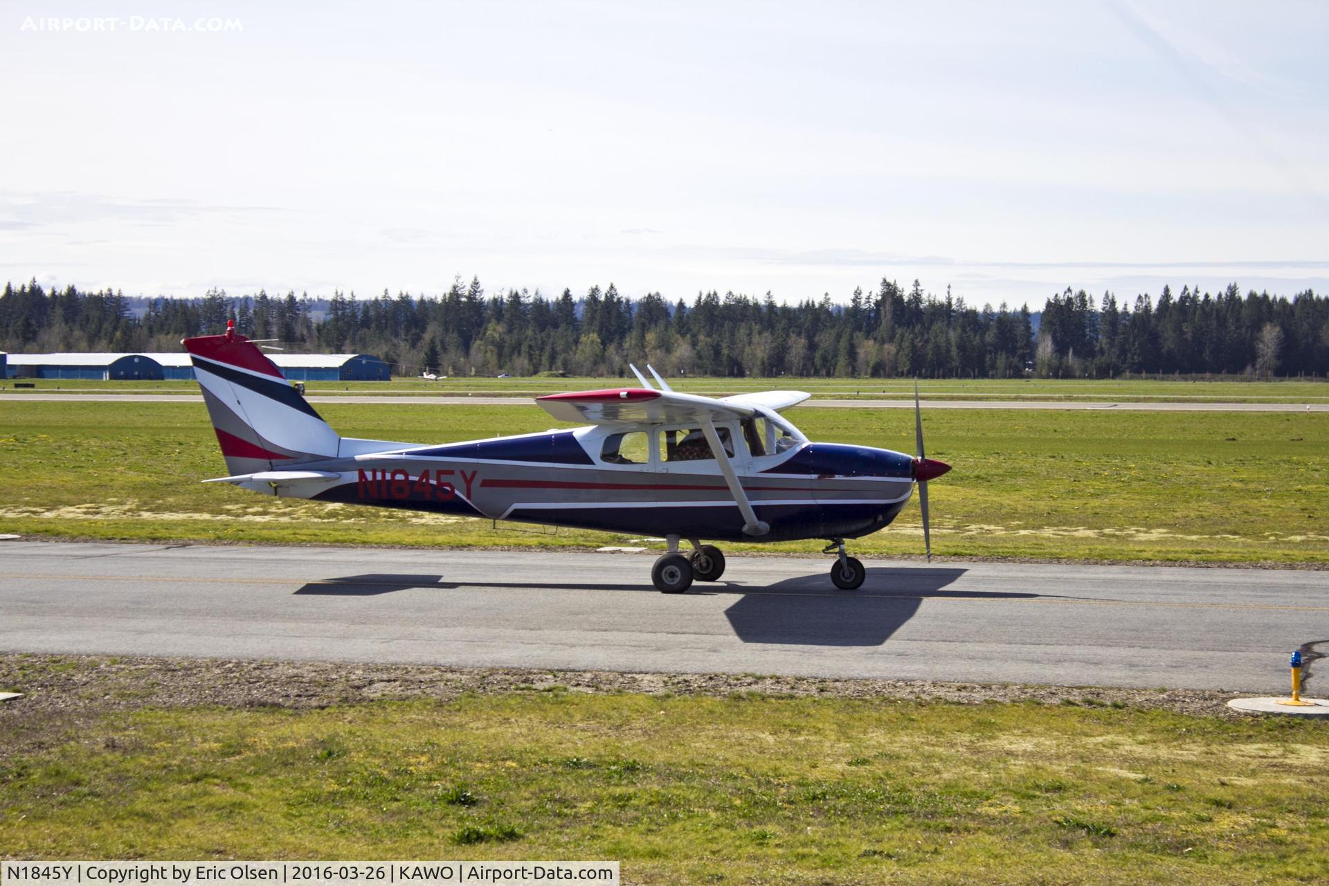 N1845Y, 1962 Cessna 172C C/N 17249445, Cessna 172C passing by Ellie's at the Airport at KAWO.