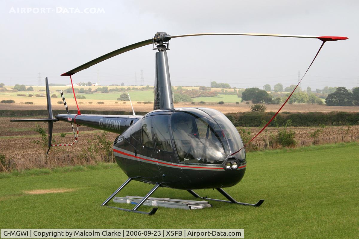G-MGWI, 2000 Robinson R44 Astro C/N 0663, Robinson R44 Astro, Fishburn Airfield, September 2006.