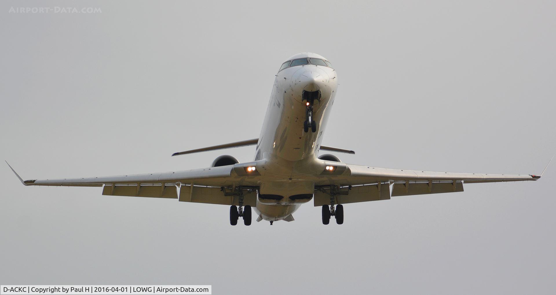 D-ACKC, 2006 Bombardier CRJ-900LR (CL-600-2D24) C/N 15078, Crj-900 shot from below, landing at LOWG