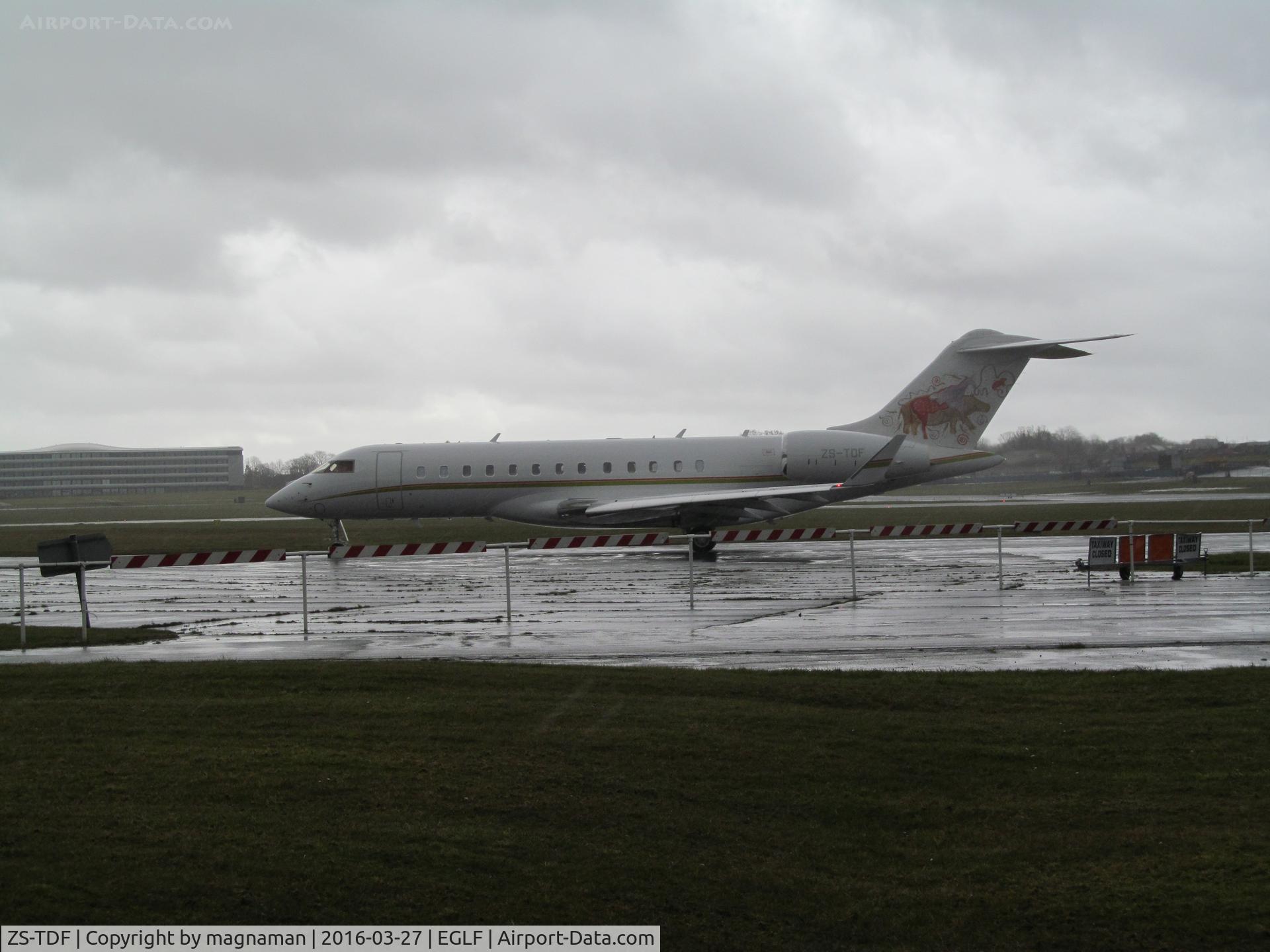 ZS-TDF, 2014 Bombardier BD-700-1A10 Global 6000 C/N 9603, leaving Farnborough just ahead of storm