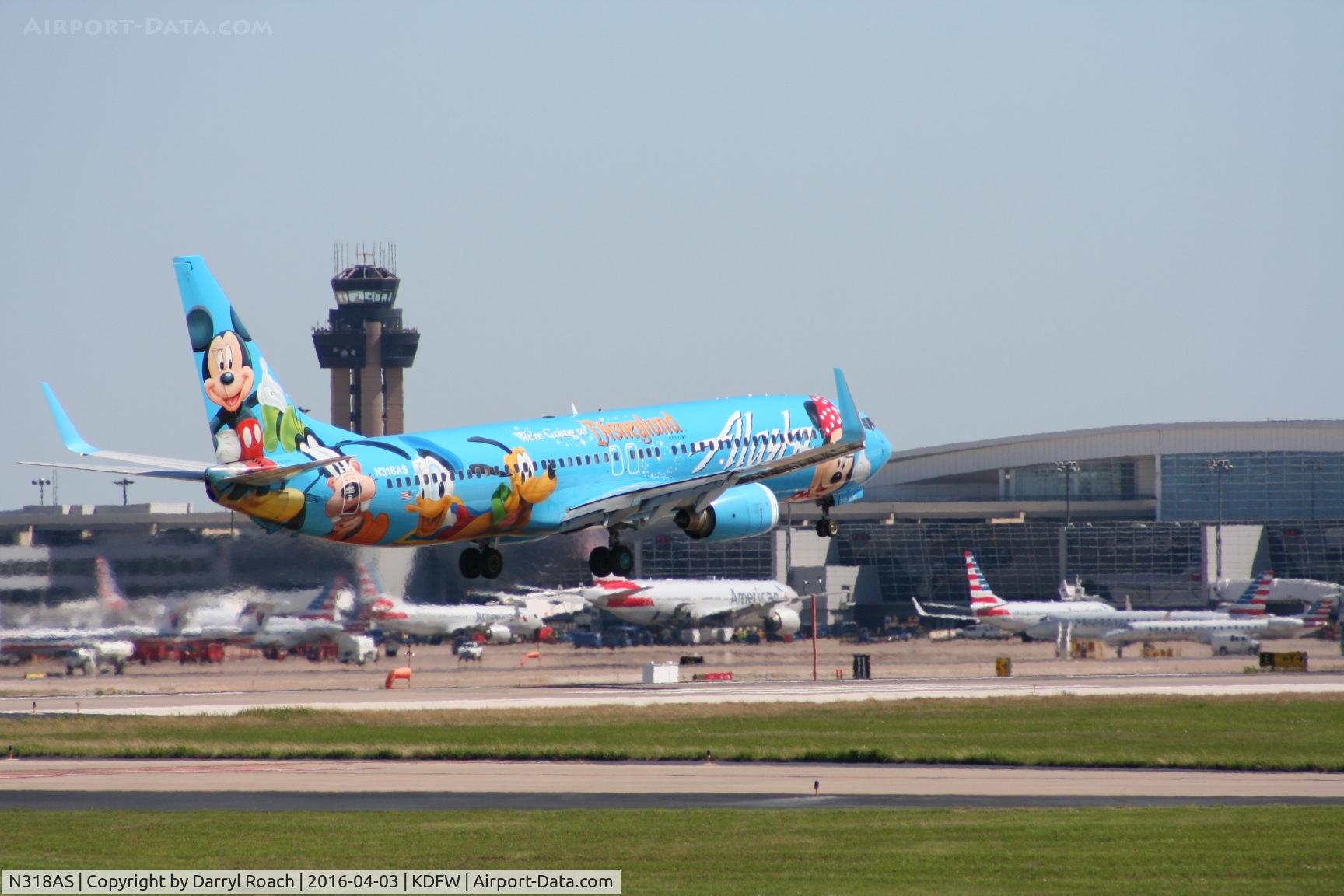 N318AS, 2003 Boeing 737-990 C/N 30018, Spirit of Disneyland  touches down 18R.