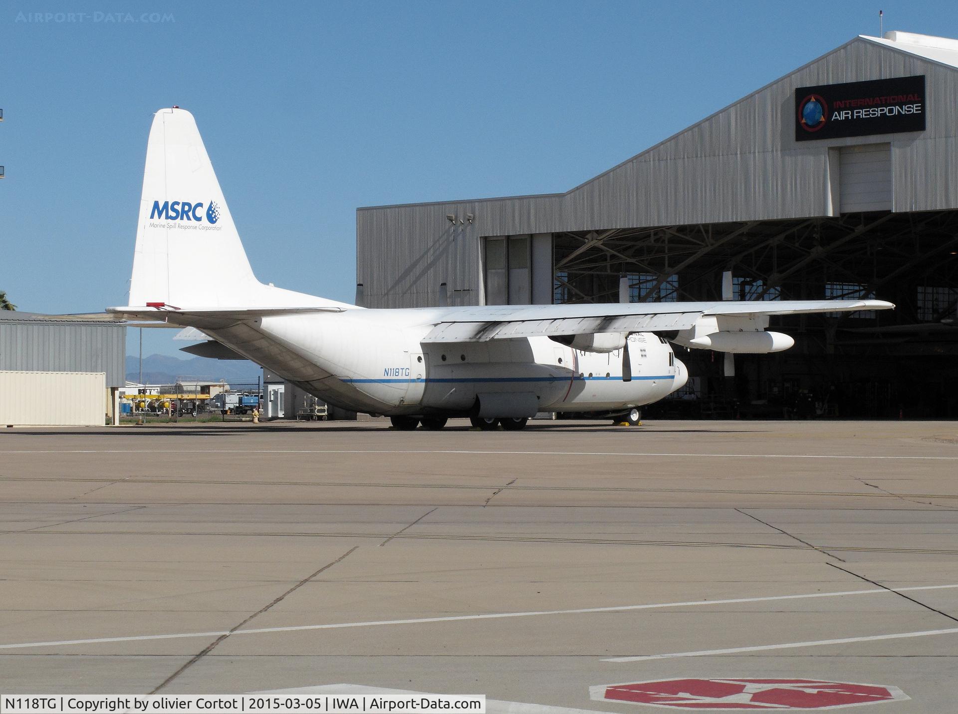 N118TG, 1957 Lockheed C-130A Hercules C/N 182-3219, with other Hercules at a maintenance facility