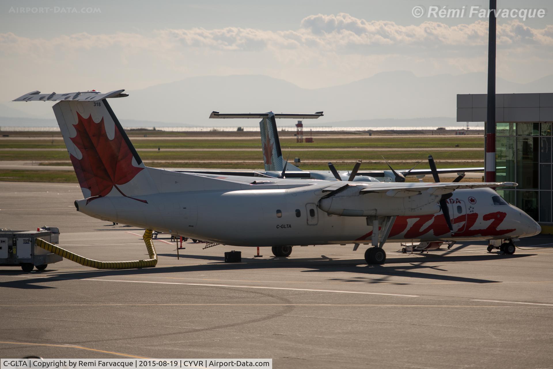 C-GLTA, 1989 De Havilland Canada DHC-8-301 Dash 8 C/N 154, Parked at domestic terminal.
