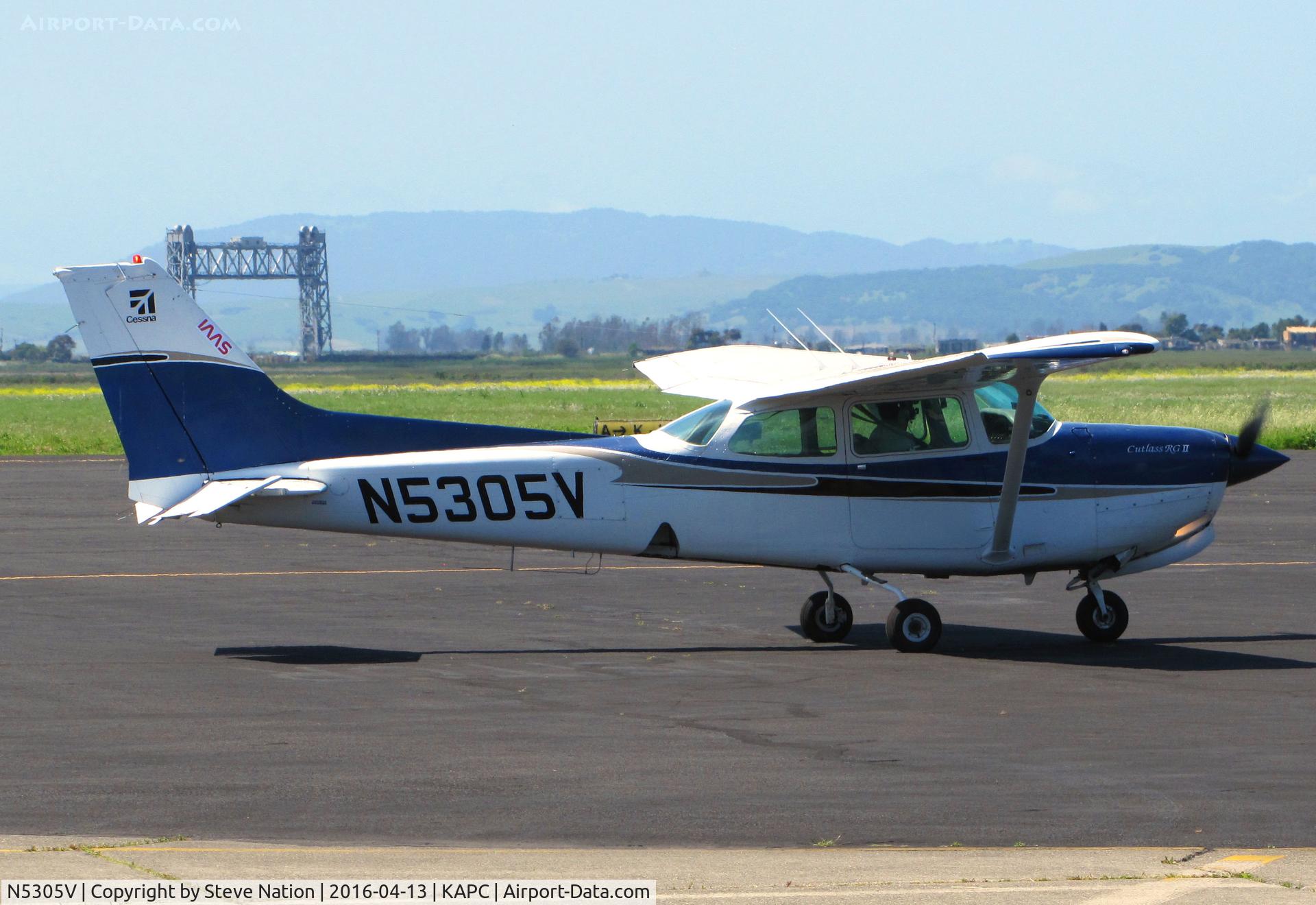 N5305V, 1980 Cessna 172RG Cutlass RG C/N 172RG0504, Michigan-based 1975 Cessna 182P taxiing in @ Napa County Airport, CA with historic Napa River RR Bridge in background