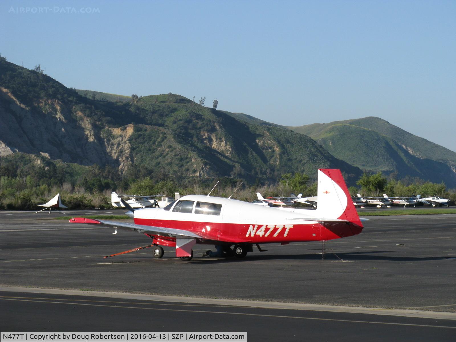 N477T, 1967 Mooney M20F Executive C/N 670274, 1967 Mooney M20F EXECUTIVE, Lycoming IO-360-A1A 200 Hp, Positive Control feature, long cabin, in prep for tug-tow to Ray's Aviation on field. Tug off photo to left...