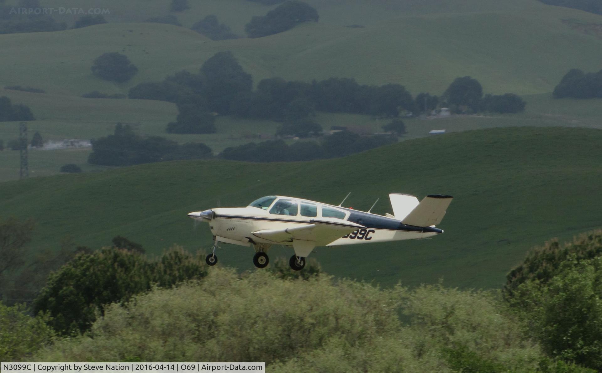 N3099C, 1958 Beech K35 Bonanza C/N D-5782, 1958 Beech K35 Bonanza climbing out from Petaluma Municipal Airport, CA between rain showers