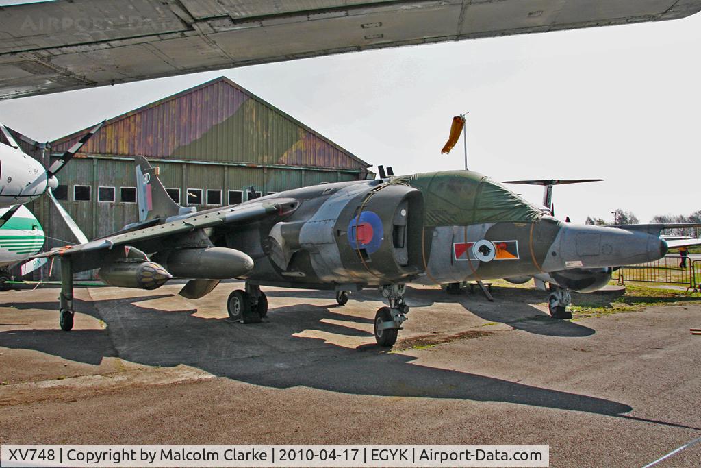 XV748, 1969 Hawker Siddeley Harrier GR.3 C/N 712011, Hawker Siddeley Harrier GR.3 from under the wing of Handley Page Herald G-AVPN at the Yorkshire Air Museum, Elvington in april 2010.