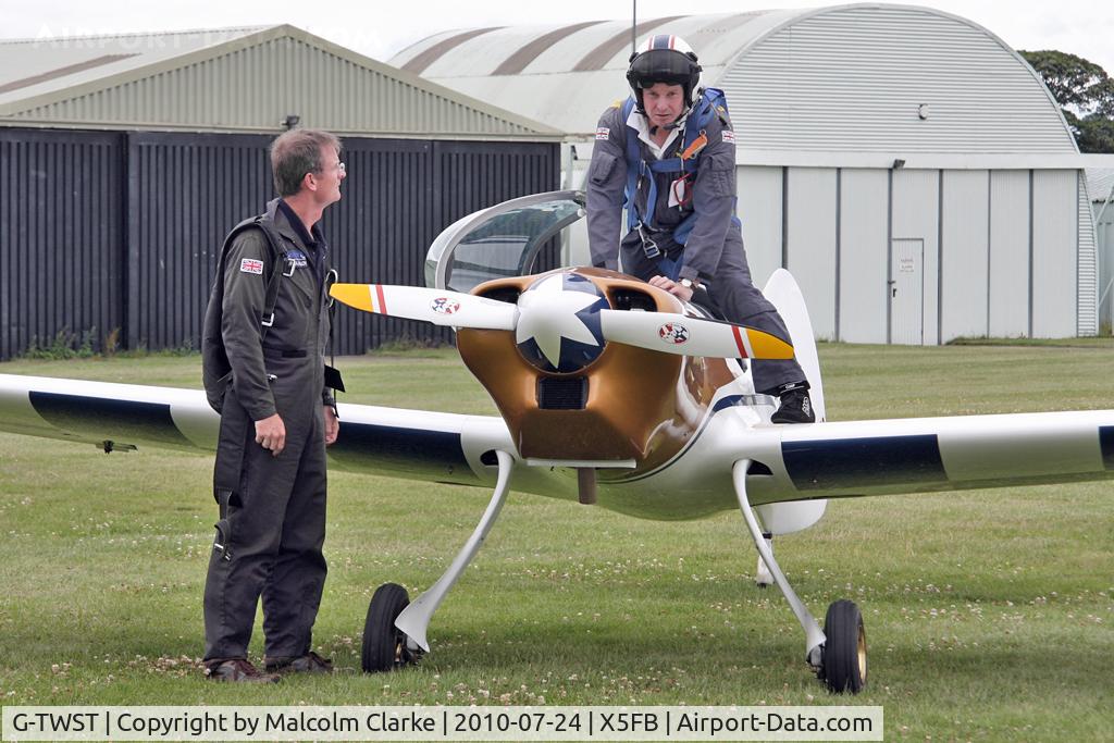 G-TWST, 2005 Silence Twister C/N PFA 329-14211, Silence Twister; climbing aboard this tiny acrobatic aircraft at Fishburn Airfield, July 2010.