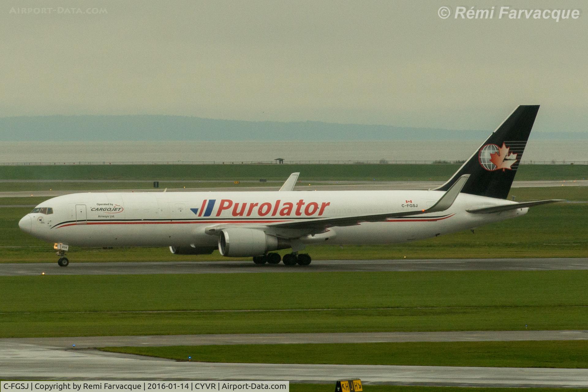 C-FGSJ, 1993 Boeing 767-39H C/N 26256, Taxiing to Purolator hanger after landing on north runway.