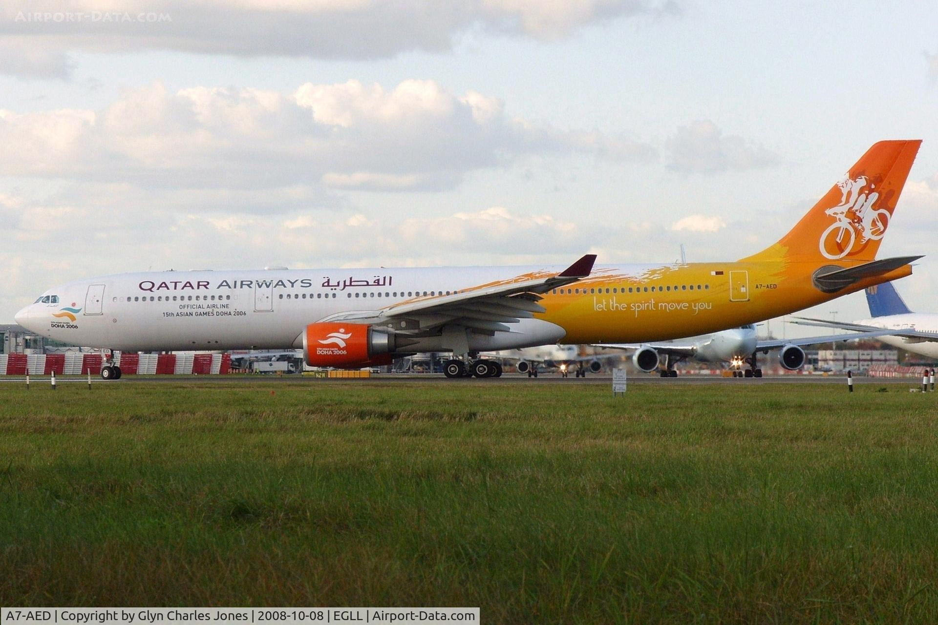 A7-AED, 2005 Airbus A330-302 C/N 680, Lining up for take off on runway 27L still showing 'Official Airline 15th Asian Games Doha 2006' colour scheme with titles 'let the spirit move you'. Test registration F-WWYD.