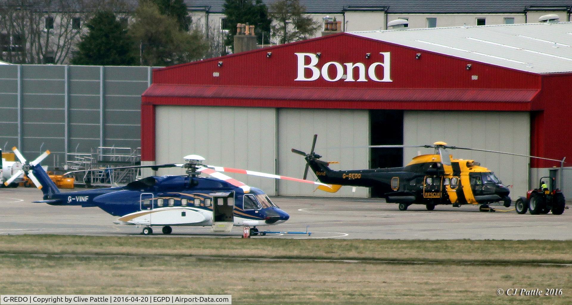 G-REDO, 2005 Eurocopter AS-332L-2 Super Puma C/N 2622, Parked up at Aberdeen EGPD with fellow Bond aircraft G-VINF