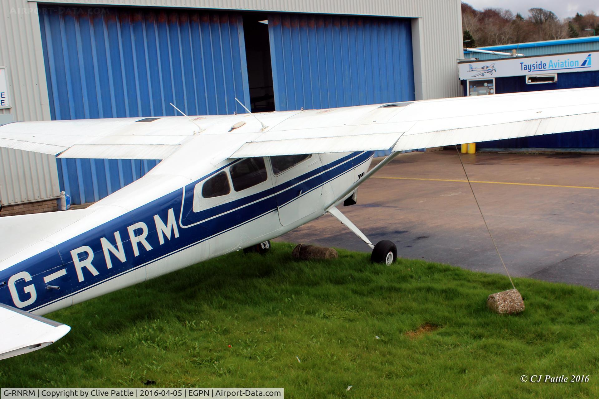 G-RNRM, 1974 Cessna A185F Skywagon 185 C/N 185-02541, Parked up at Tayside Aviation's engineering facility at Dundee Riverside EGPN. sporting a refined colour scheme - it has now lost its distinctive Royal Marines coloured cheat-line.