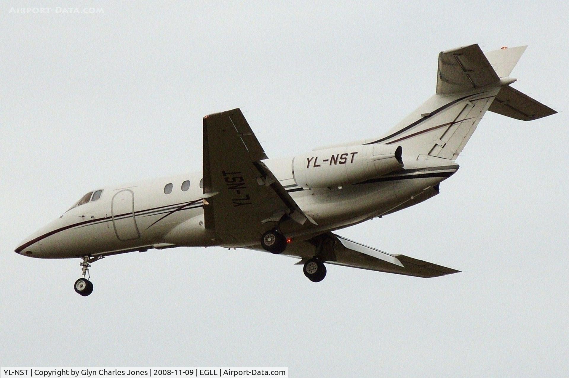 YL-NST, 1999 Raytheon Hawker 800XP C/N 258424, On finals to runway 27L. Previously N1899K. Owned by PAREX Aviation/VIP Avia.